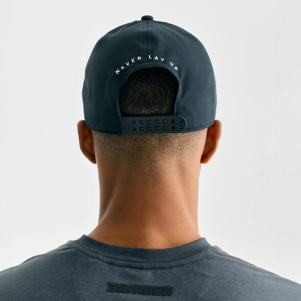 Zone Snapback, men's black snapback hat, back view adjusting closure
