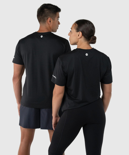 Ignite T-Shirt, black unisex performance t-shirt with silicone Bomber back yoke logo, back view