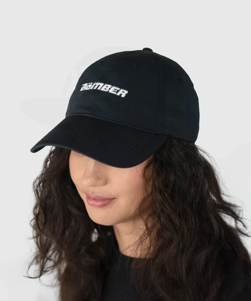 Radiance Hat, black performance hat worn by woman, front view
