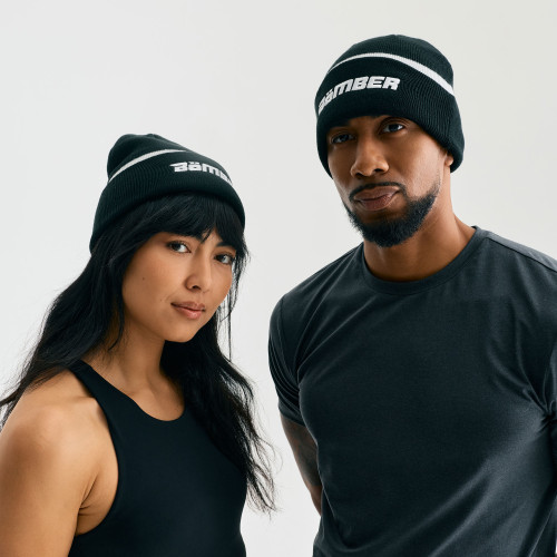 Charge Beanie, unisex black cuffed knit beanie, male and female models, front view