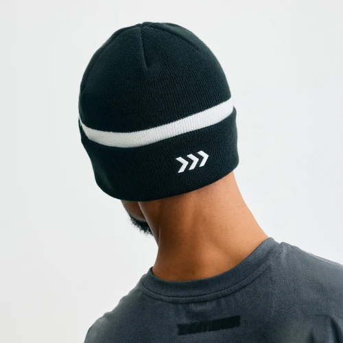 Charge Beanie, unisex black cuffed knit beanie, male model, back view