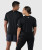Ignite T-Shirt, black unisex performance t-shirt with silicone Bomber back yoke logo, back view