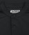 Core MB Polo, black blade collar with two-button placket, close-up view