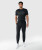 Triumph Jogger, men's black performance jogger with athletic tapered fit, worn by model