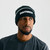 Charge Beanie, unisex black cuffed knit beanie, male model, front view