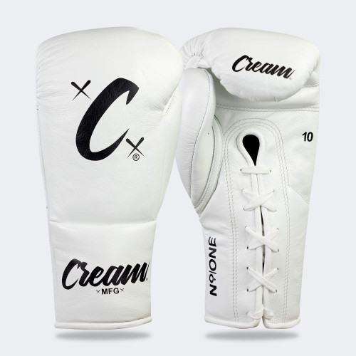 Photo of a pair of Combat Corner's white Cream TM1 Competition Boxing Gloves, which are Japanese inspired Mexican Boxing Gloves that are hand made in Thailand. Photo of a pair of Combat Corner's white Cream TM1 Competition Boxing Gloves, which are Japanese inspired Mexican Boxing Gloves that are hand made in Thailand.