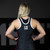 Photo of a college female athlete wearing Combat Corner’s premium Classic Combat Corner Wrestling Singlet. The woman is standing in Combat Corner’s collegiate wrestling training gym. She is standing with her back to camera to show the rear angle of the Classic Combat Corner Wrestling Singlet. This Classic Combat Corner Singlet gives you champion performance in Folkstyle, Freestyle, and Greco-Roman wrestling. Plus, this singlet serves all wrestling athletes. This singlet is designed for kids to adults and for men and women.