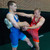 2 Freestyle Wrestlers in Red and Blue Singlets