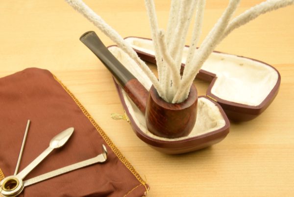 A tobacco pipe cleaner essential absorbent tools made with cotton fibers and a wire core used to clear moisture, tar, and ash from the stem and shank