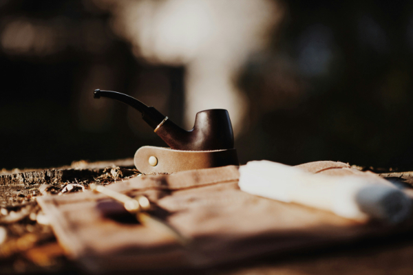 A travel pipe rest is a compact, portable accessory designed to safely hold a tobacco pipe when you are away from home
