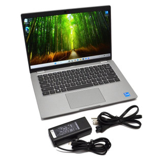 Open laptop with its power adapter