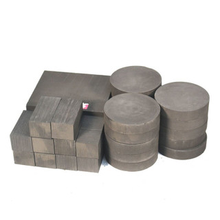 Stacked graphite blocks and round pucks