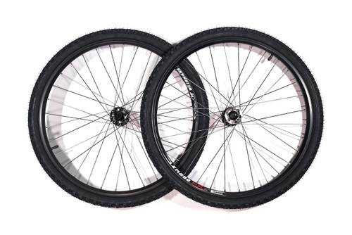 A pair of black mountain bike wheels with knobby, off-road tires and wire spokes, displayed side-by-side against a white background.