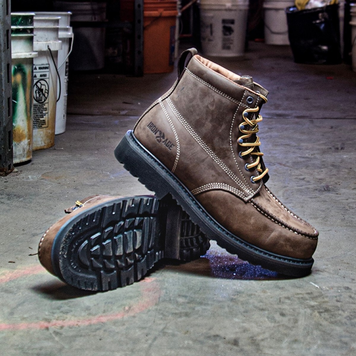Iron Age Static Dissipative Work Boots A rugged pair of Iron Age static dissipative work boots posed on a supply room's concrete floor.