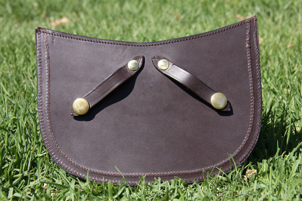 Brass press studs on rear.