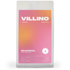 A white back of single origin coffee with pink and purple label. The white letters at the top of the label reads "Villino Coffee Roasters",  and the small white text at the bottom reads "Seasonal Filter Blend #17".