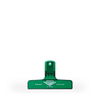 A clear green plastic bag clip.