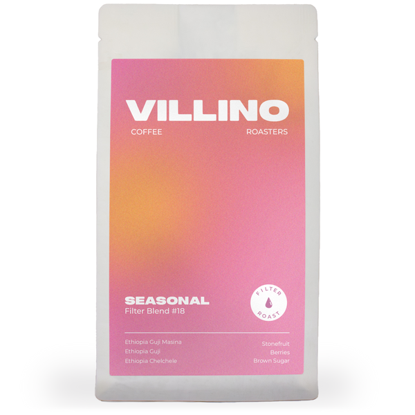 A white back of single origin coffee with pink and purple label. The white letters at the top of the label reads "Villino Coffee Roasters",  and the small white text at the bottom reads "Seasonal Filter Blend #17".