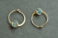 11mm (7/16") gold hoops with blue topaz