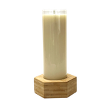 Jumbo glass tube scented candle in a clear glass cylinder, in a hexagonal  bamboo stand.