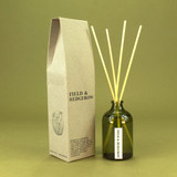 Green Botanical Field & Hedgerow100ml apothecary glass reed diffuser by Heaven Scent with natural reed sticks and illustrated packaging.
