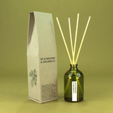 Green Botanical Blackberries & Brambles 100ml apothecary glass reed diffuser by Heaven Scent with natural reed sticks and illustrated packaging.
