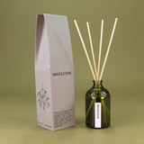 Green Botanical Mistletoe 100ml apothecary glass reed diffuser by Heaven Scent with natural reed sticks and illustrated packaging.