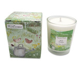 A Heaven Scent 9cl scented votive candle in a clear glass jar alongside its matching illustrated gift box. Both the candle label and the box feature. Aroma: Wildflower; Illustration: Chickens & Watering Can