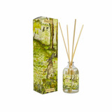 A Heaven Scent 100ml reed diffuser kit featuring a clear apothecary-style glass bottle, a bundle of 10 natural rattan reed sticks and an elegantly illustrated gift box. Aroma: Fern; Illustration: Mossy Dell