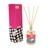 A Heaven Scent new SUMMER 100ml Reed Diffuser in a clear glass apothecary bottle with 10 natural reed sticks alongside its matching illustrated gift box. Aroma: Caffe Martini; Illustration: Espresso Martini on a chequerboard table cloth