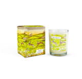 A Heaven Scent 9cl scented votive candle in a clear glass jar alongside its matching illustrated gift box. Both the candle label and the box feature. Aroma: Apple Blossom; Illustration: Dancing Hares.