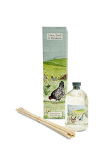 A Heaven Scent 100ml reed diffuser kit featuring a clear apothecary-style glass bottle, a bundle of 10 natural rattan reed sticks and an elegantly illustrated gift box. Aroma: Lime, Basil & Mandarin; Illustration: Chickens & Shed