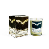 A Heaven Scent Autumn/Winter 9cl scented votive candle in a clear glass jar alongside its matching illustrated gift box. Both the candle label and the box feature. Aroma: Snow Forest; Illustration: Wild Woods Swooping Owl