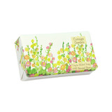 A Heaven Scent new spring/summer 150g natural soap bar, wrapped in an illustrative recyclable paper. Aroma: Cottage Garden - Rose & Patchouli; Illustration: A garden full of hollyhocks