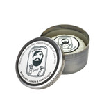 Heaven Scent Bergamot, Lemon & Grapefruit natural shaving soap for men. A rustic metal tin with an illustration of a bearded man by Sarah Pettitt on the lid. The plant-based, UK-made soap is shown pleat wrapped inside the open tin with a matching hand-drawn label.