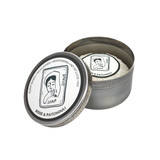 Heaven Scent Rose and Patchouli natural origin shaving soap in a rustic metal tin. The lid features a black and white Sarah Pettitt illustration of a woman, with text reading plant-based, rich lather, and moisturising. The soap inside is pleat wrapped with a matching illustrated label.