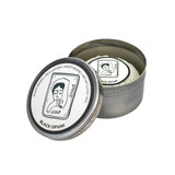 Heaven Scent  Black Opium natural origin shaving soap in a rustic metal tin. The lid features a black and white Sarah Pettitt illustration of a woman, with text reading plant-based, rich lather, and moisturising. The soap inside is pleat wrapped with a matching illustrated label.