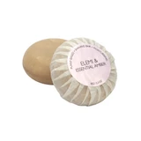 A round bar of Heaven Scent Heritage natural origin shaving soap, pleat wrapped in white paper. The top features a pale lilac circular label for the Elemi & Essential Amber scent.  Made in the UK using sustainable plant-based ingredients.