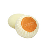 A round bar of Heaven Scent Heritage natural origin shaving soap, pleat wrapped in white paper. The top features a orange circular label for the Citrus, Rosemary & Petitgrain scent.  Made in the UK using sustainable plant-based ingredients.