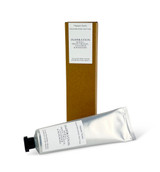 A 60ml tube of Inspiration cocoa & shea butter hand cream with a Heaven Scent Classic Brading label, standing next to its eco-friendly brown card packaging.