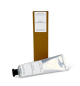 A 60ml tube of Black Pomegranate cocoa & shea butter hand cream with a Heaven Scent Classic Brading label, standing next to its eco-friendly brown card packaging.