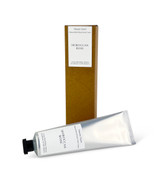 A 60ml tube of Moroccan Rose cocoa & shea butter hand cream with a Heaven Scent Classic Brading label, standing next to its eco-friendly brown card packaging.