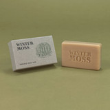 Green Botanical 100g Winter Moss natural soap bar by Heaven Scent with stamped text next to its illustrated recycled card box.
