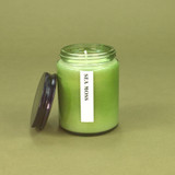 Green Botanical 150ml pharmacy jar Sea Moss scented candle by Heaven Scent in a glass jar with a black lid.