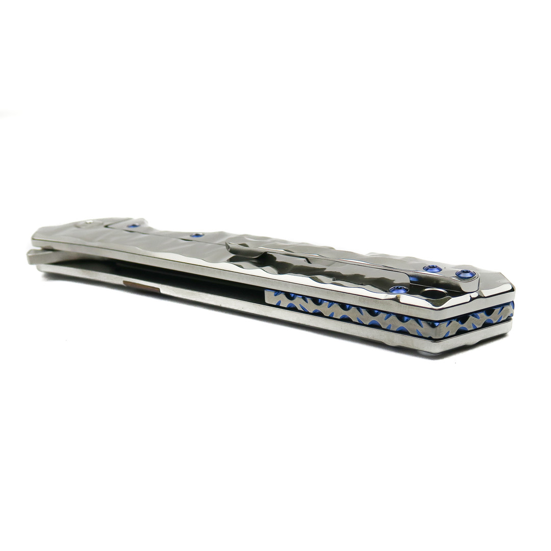 Olamic Cutlery Isolo SE High Polished Ti Rainmaker Flipper Knife, High Polish Compound Harpoon Blade, Spine View