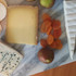 Cheese platter blue hard brie soft cheese crackers fruit paste