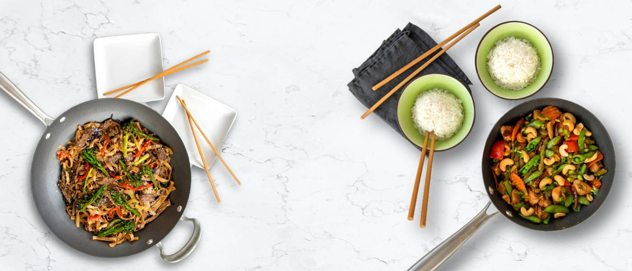 The Nordic Ware Spun Woks filled with Asian dishes. Make your favorite tasty Asian dishes at home!