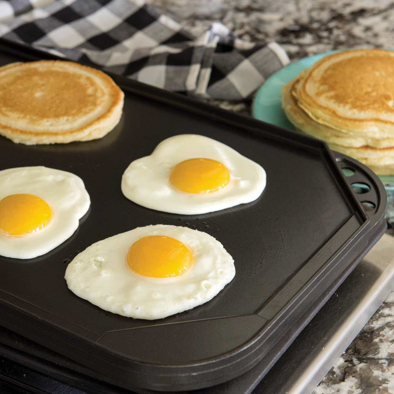 https://cdn11.bigcommerce.com/s-21kj3ntgv1/images/stencil/1280x1280/products/434/2613/NordicWare-ProCast-Classic-Original-Reversible-Griddle-with-Breakfast-Food__82868.1698614522.jpg?c=2