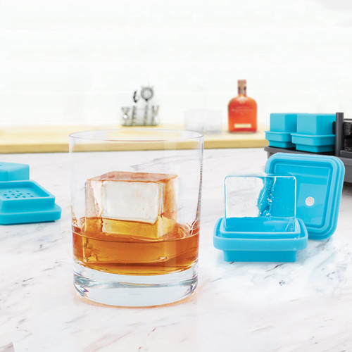 Tovolo King Cube Ice System Set of 4 In Use in a Glass