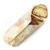 A Bee's Wrap bread wrap in Honeycomb Print wrapping bread.